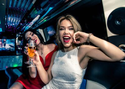 Pretty Women Having Party In A Limousine Car